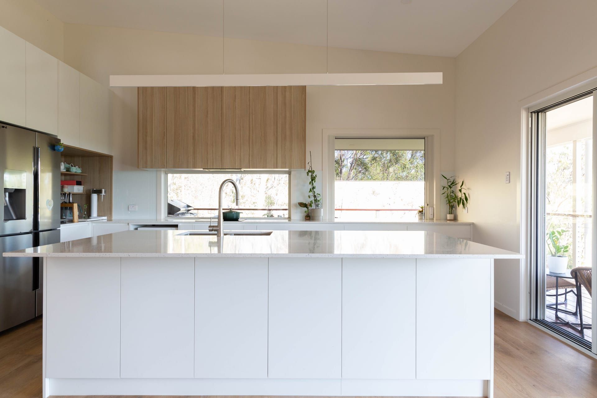 Open plan kitchen with island bench and vaulted ceiling